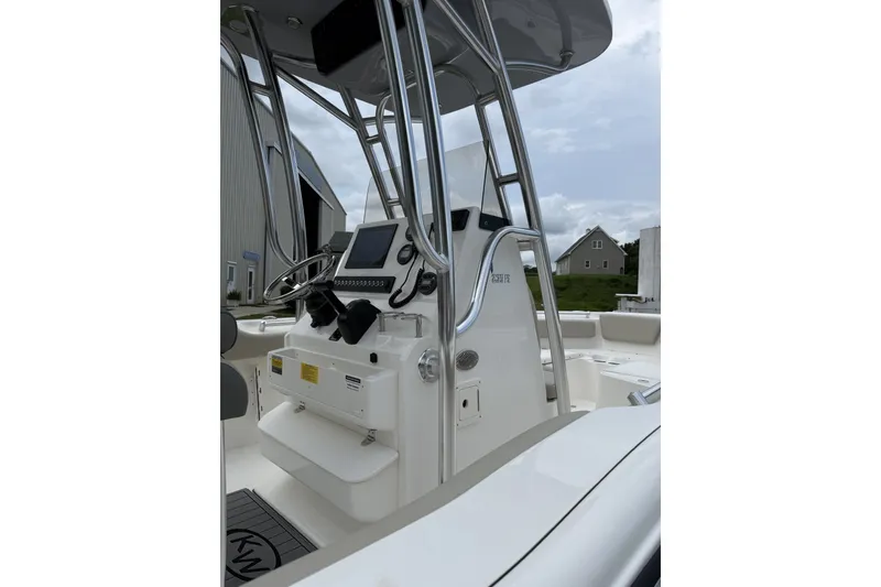 Slide: The Image of The image shows the helm of a Key West 239 FS boat with modern electronics. - 2