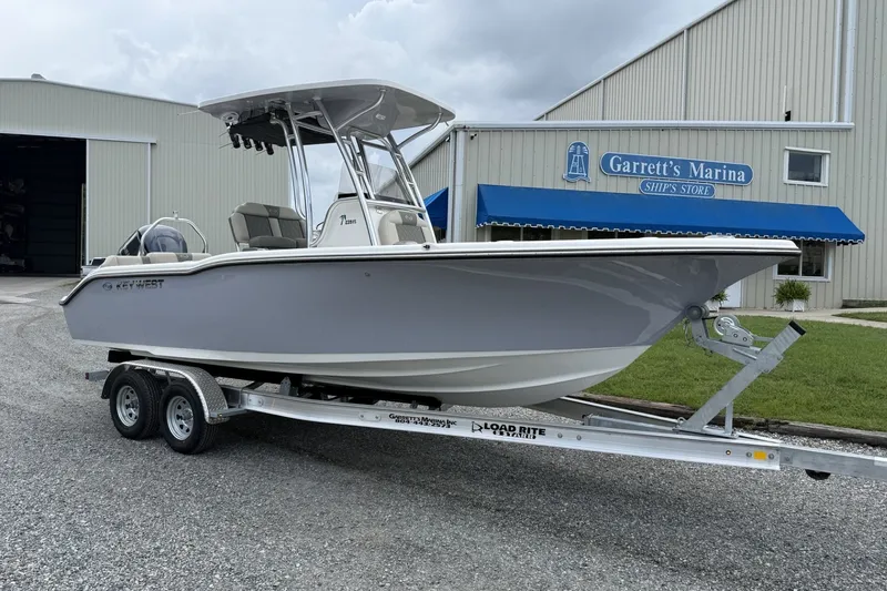 The Image of Key West 239 FS 2027 on a trailer in front of a marina. - 0