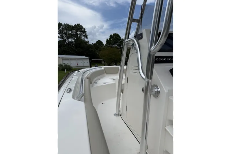 Slide: The Image of The image shows the deck of a Key West 239 FS boat with stainless steel railing. - 7