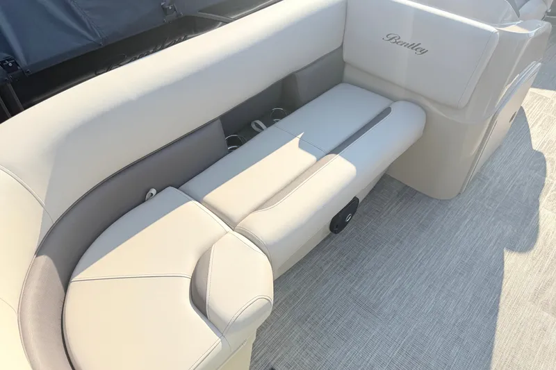 Slide: The Image of Luxurious seating on 2027 Bentley Pontoons LE 180CR, featuring elegant beige upholstery. - 17