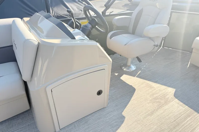 Slide: The Image of Interior of 2027 Bentley Pontoons LE 180CR, featuring helm and captain's chair. - 15
