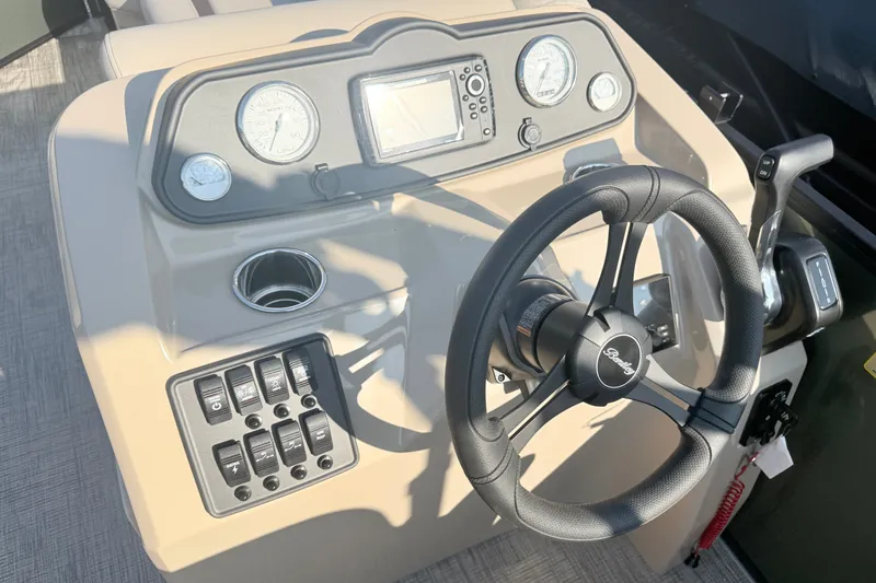 Slide: The Image of Steering console of 2027 Bentley Pontoons LE 180CR with gauges and controls. - 9