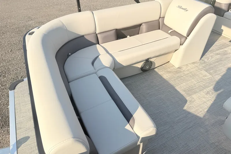 Slide: The Image of 2027 Bentley Pontoons LE 180CR interior with luxurious beige seating and modern design. - 7
