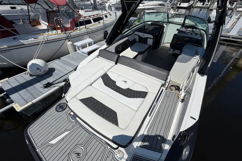 Slide: The Image of 2018 Monterey 298SS Super Sport boat docked at marina, featuring sleek seating and modern design. - 7