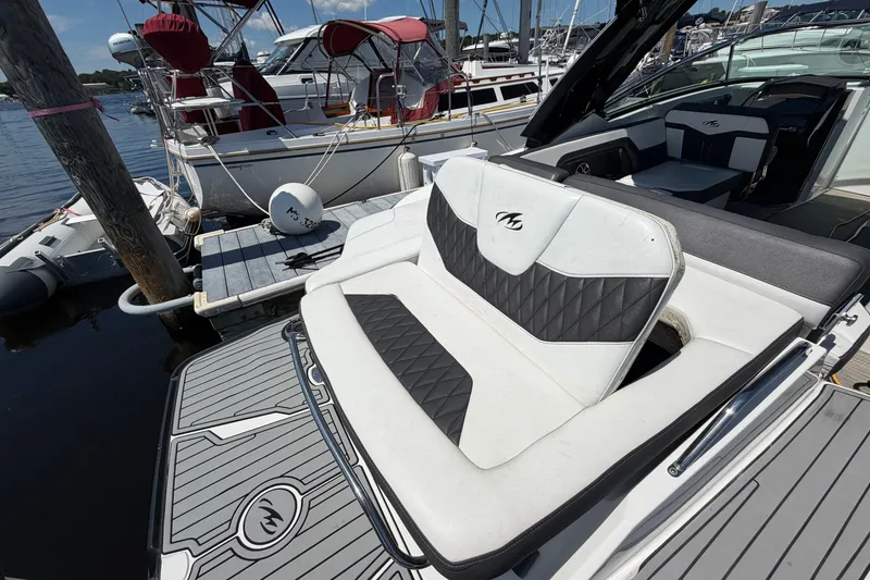Slide: The Image of 2018 Monterey 298SS Super Sport boat with sleek seating at a marina dock. - 8