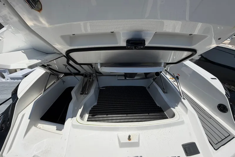 Slide: The Image of Open storage compartment of 2018 Monterey 298SS Super Sport boat, showcasing interior details. - 6