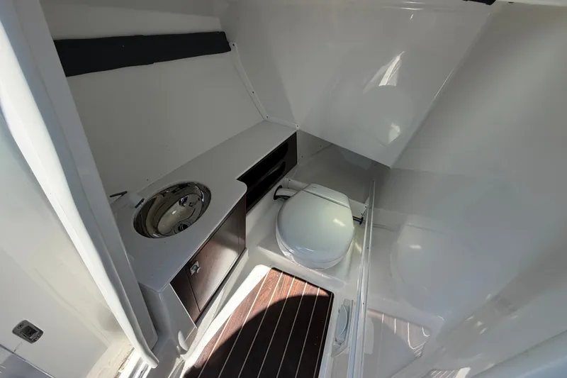 Slide: The Image of 2018 Monterey 298SS Super Sport boat bathroom with sink and toilet. - 23