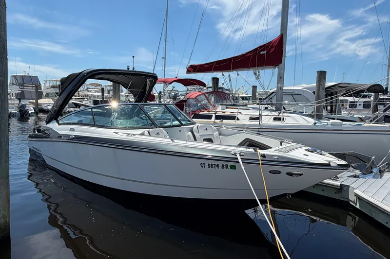 The Image of 2018 Monterey 298SS Super Sport boat docked at marina under clear blue sky. - 0
