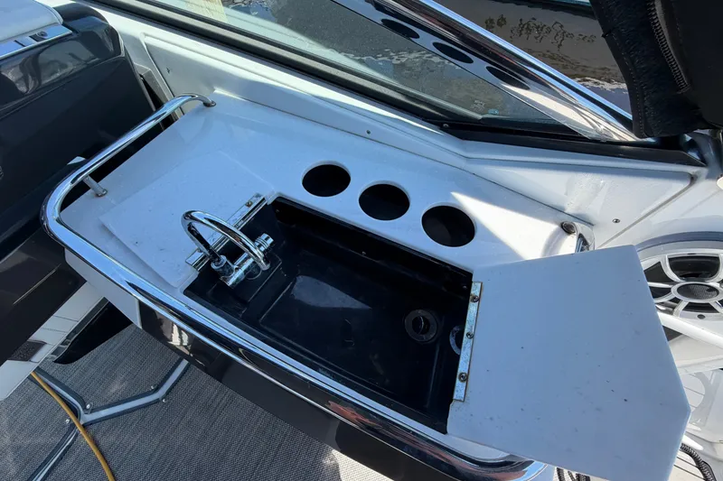 Slide: The Image of Wet bar with sink and cup holders on 2018 Monterey 298SS Super Sport boat. - 16