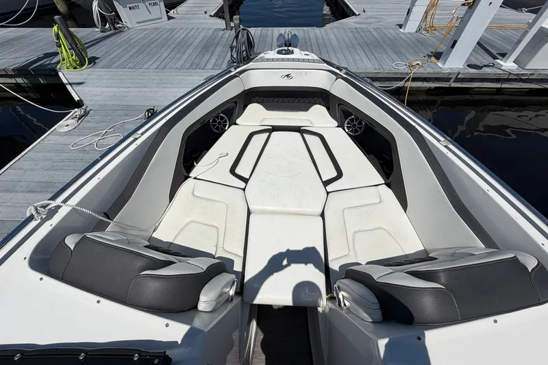 Slide: The Image of 2018 Monterey 298SS Super Sport boat interior at dock, featuring spacious seating. - 31