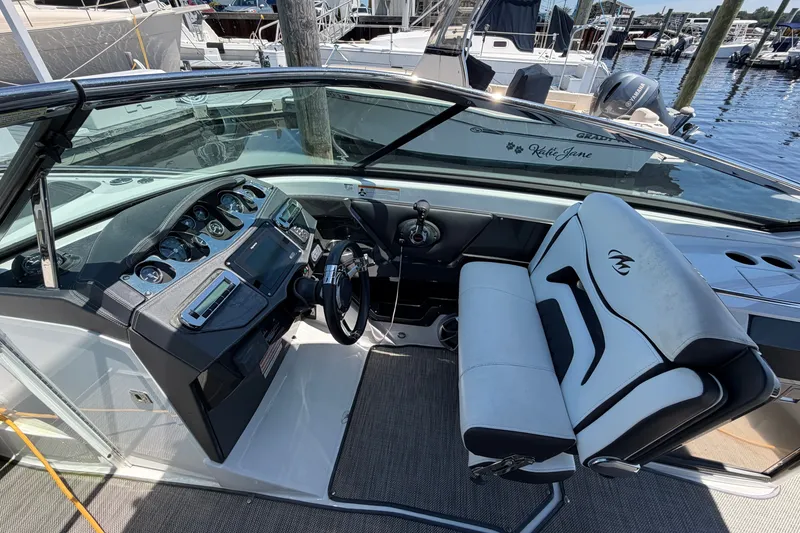 Slide: The Image of Cockpit of 2018 Monterey 298SS Super Sport boat with modern controls and seating. - 25