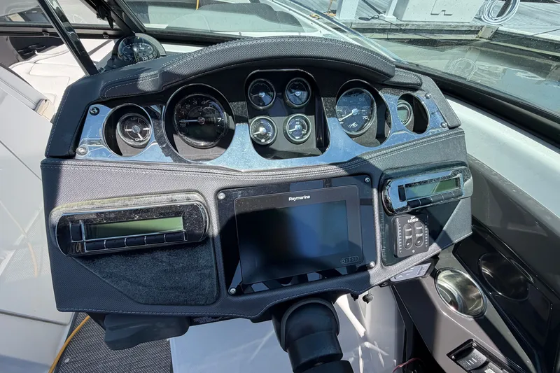 Slide: The Image of Dashboard of a 2018 Monterey 298SS Super Sport boat with gauges and controls. - 27