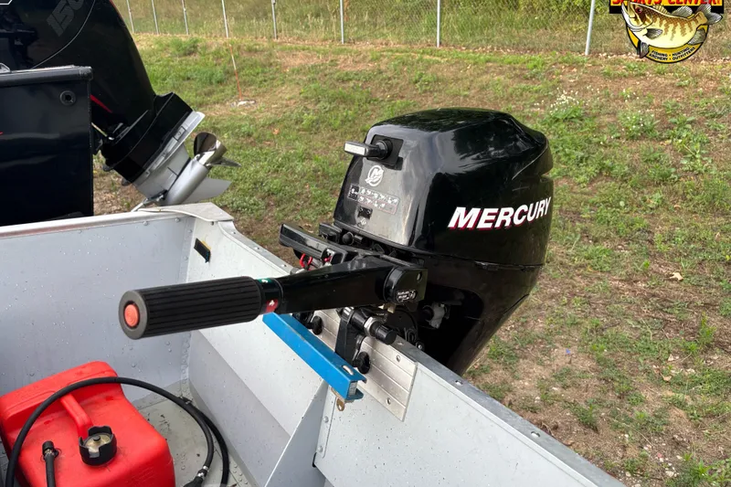 Slide: The Image of 2011 Lund WD 14 boat with Mercury outboard motor and red fuel tank. - 5