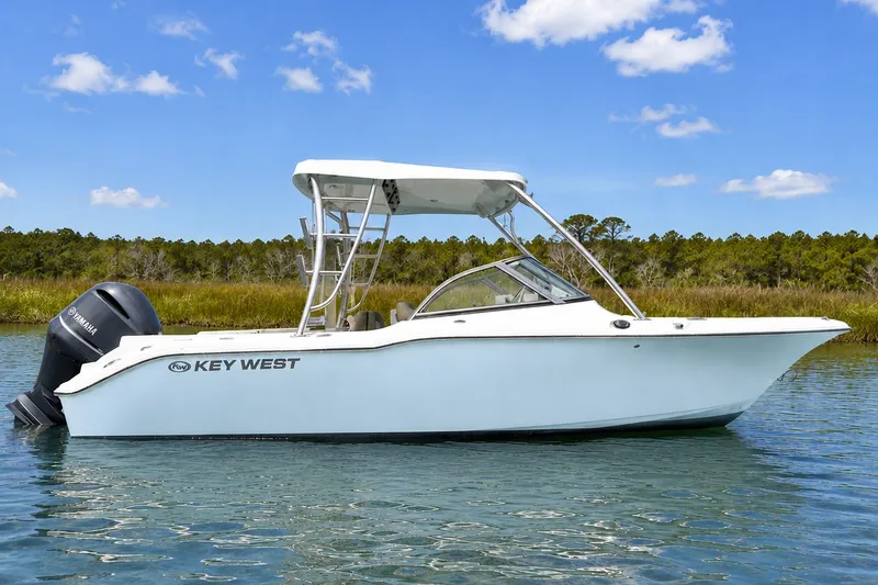 The Image of 2024 Key West 239 DFS boat on calm water, featuring sleek design and Yamaha engine. - 0