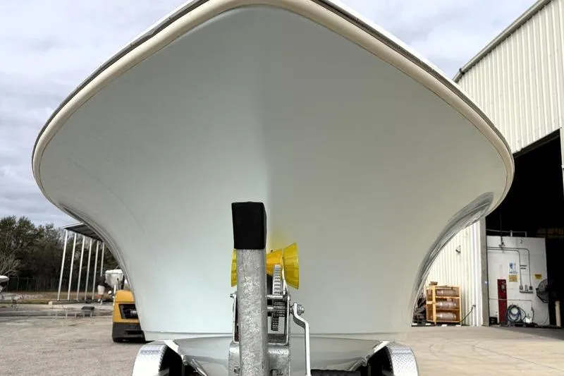 Slide: The Image of 2024 Key West 239 DFS boat on trailer, front view near warehouse. - 8