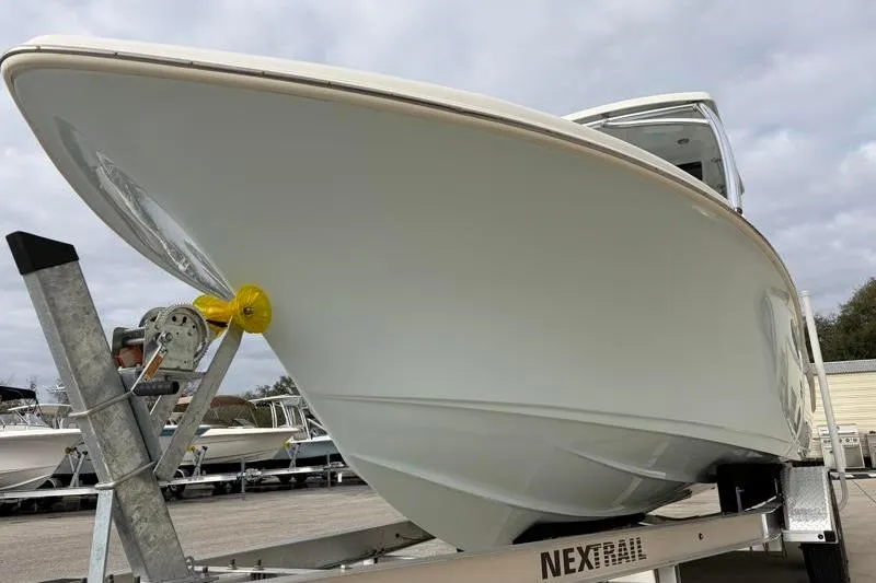 Slide: The Image of 2024 Key West 239 DFS boat on trailer, showcasing sleek design and sturdy build. - 10
