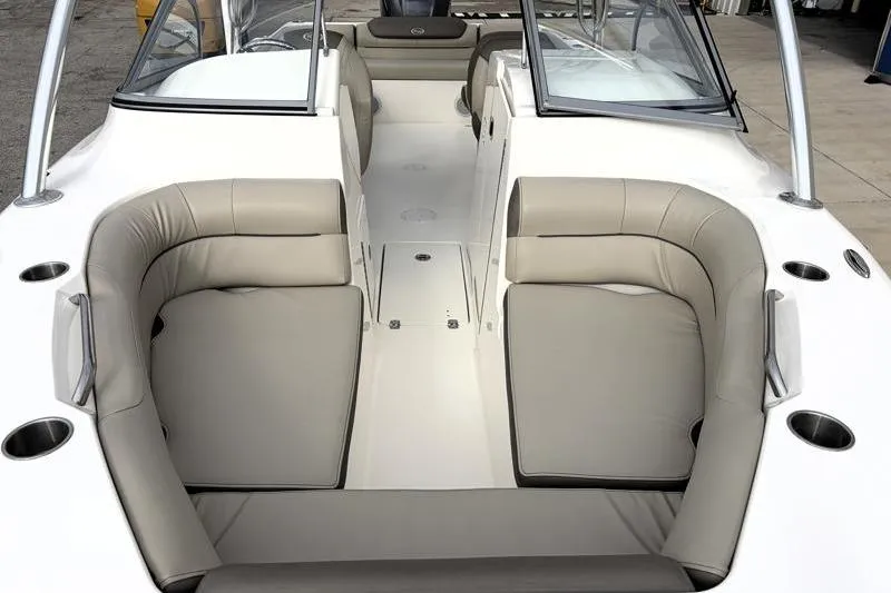Slide: The Image of 2024 Key West 239 DFS boat interior with beige seating and cup holders. - 7
