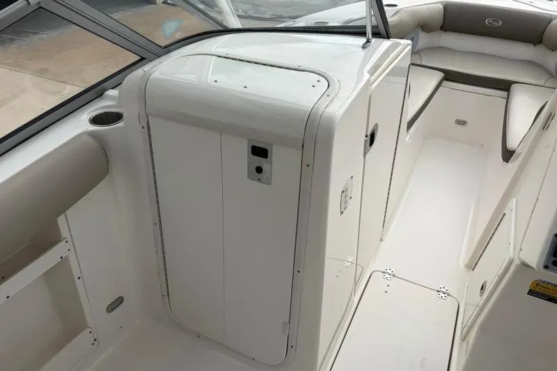 Slide: The Image of 2024 Key West 239 DFS boat interior with seating and storage compartments. - 23
