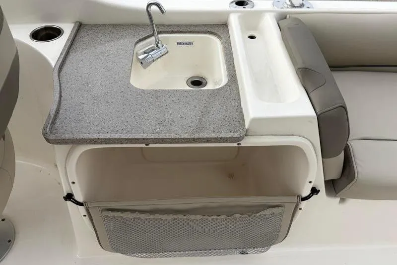 Slide: The Image of 2024 Key West 239 DFS boat interior with sink and storage area. - 27