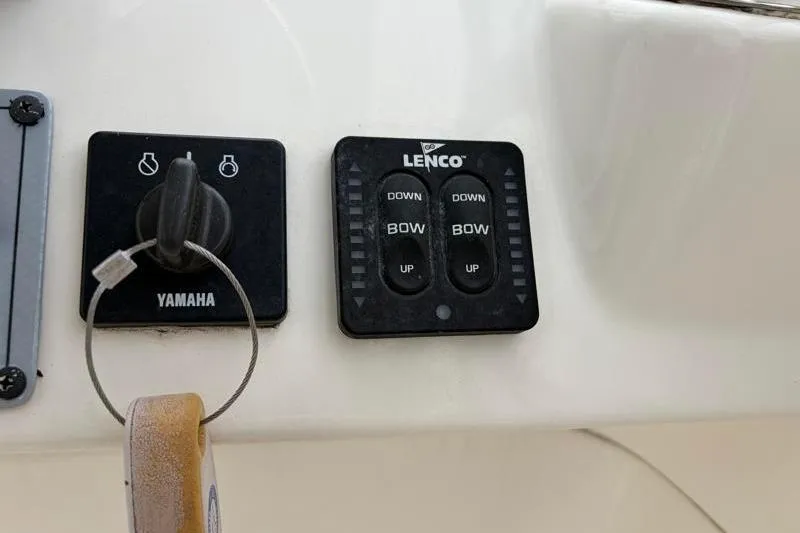 Slide: The Image of Control panel of a 2024 Key West 239 DFS boat with Yamaha and Lenco switches. - 21