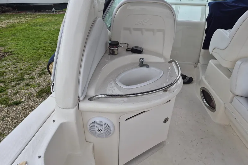 Slide: The Image of 2005 Sea Ray 340 Sundancer boat interior with sink and seating area. - 7