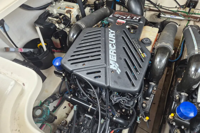 Slide: The Image of Engine compartment of a 2005 Sea Ray 340 Sundancer with Mercury engine. - 25