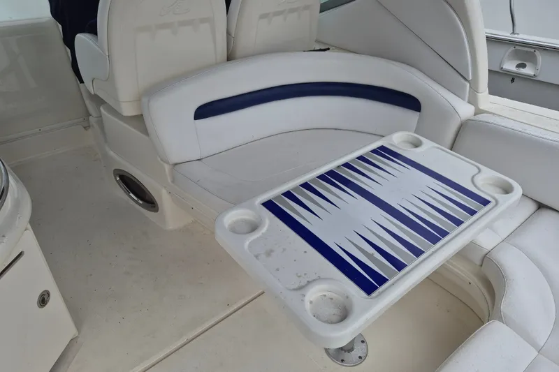 Slide: The Image of Interior of 2005 Sea Ray 340 Sundancer with seating and a backgammon table. - 12
