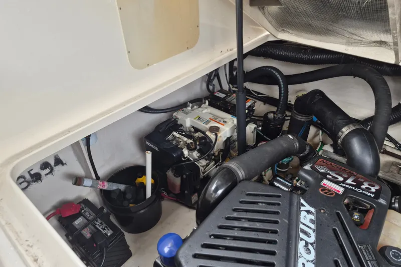 Slide: The Image of Engine compartment of 2005 Sea Ray 340 Sundancer with Mercury components and Kohler generator. - 24