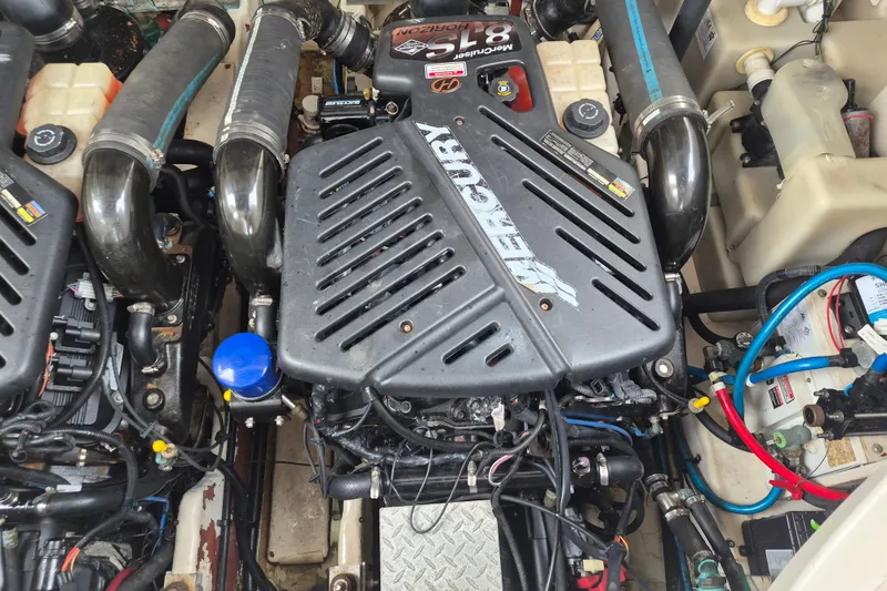Slide: The Image of Engine compartment of a 2005 Sea Ray 340 Sundancer with Mercury components. - 26