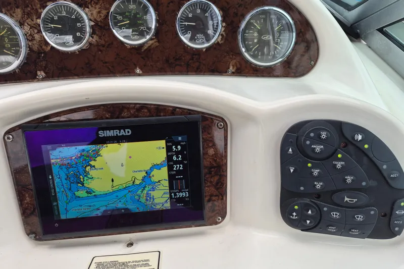 Slide: The Image of Dashboard of a 2005 Sea Ray 340 Sundancer with Simrad navigation display and control panel. - 5