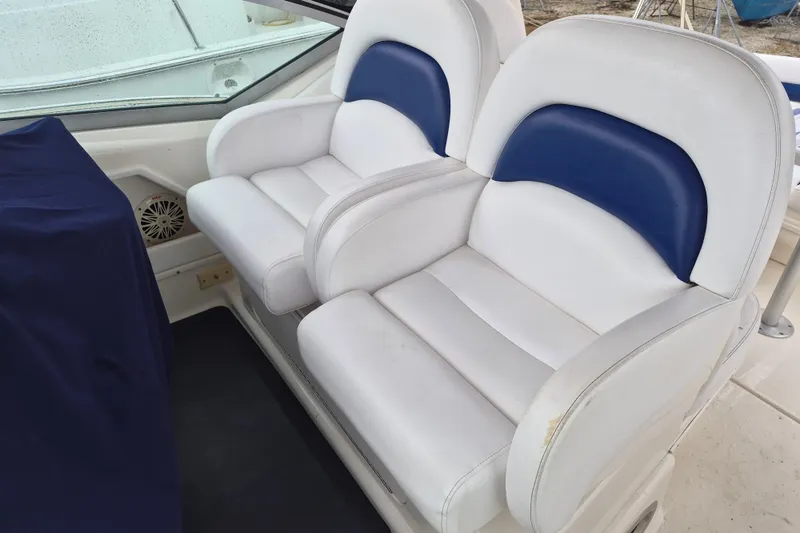 Slide: The Image of White and blue seating on 2005 Sea Ray 340 Sundancer boat. - 11