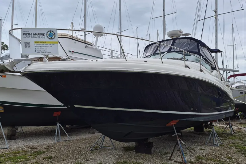 Slide: The Image of 2005 Sea Ray 340 Sundancer yacht on stands at Pier-1 Marine Yacht Brokerage. - 1