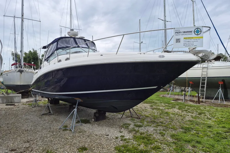 Slide: The Image of 2005 Sea Ray 340 Sundancer yacht on stands at a marina. - 3