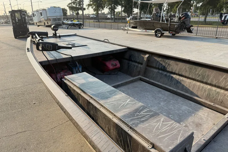 Slide: The Image of 2015 Custom Pro Drive 1754 boat with open deck and trolling motor. - 11