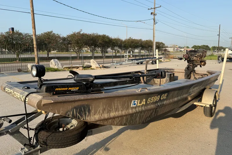 Slide: The Image of 2015 Custom Pro Drive 1754 boat on trailer with Minn Kota trolling motor. - 6
