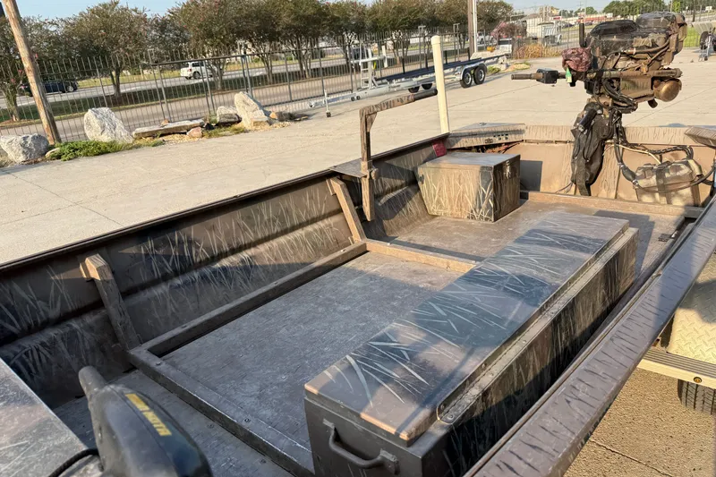 Slide: The Image of 2015 Custom Pro Drive 1754 boat with camouflage interior, parked outdoors. - 13