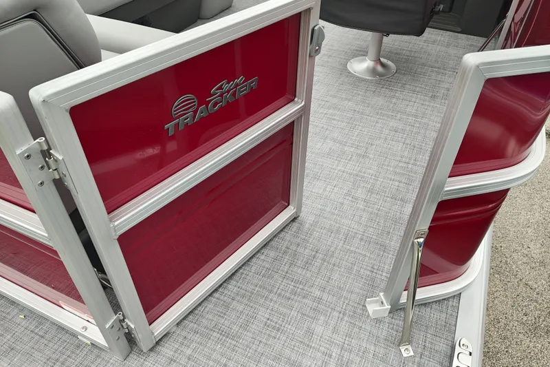 Slide: The Image of 2026 Sun Tracker Party Barge 20 DLX interior with open gate and seating. - 18