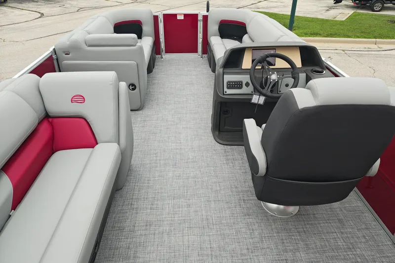 Slide: The Image of 2026 Sun Tracker Party Barge 20 DLX interior with plush seating and modern helm. - 19