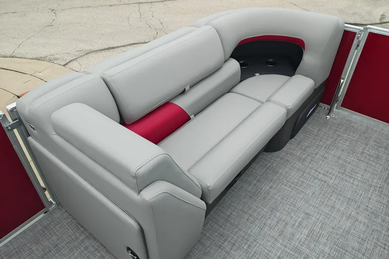 Slide: The Image of 2026 Sun Tracker Party Barge 20 DLX interior with gray and red seating. - 23