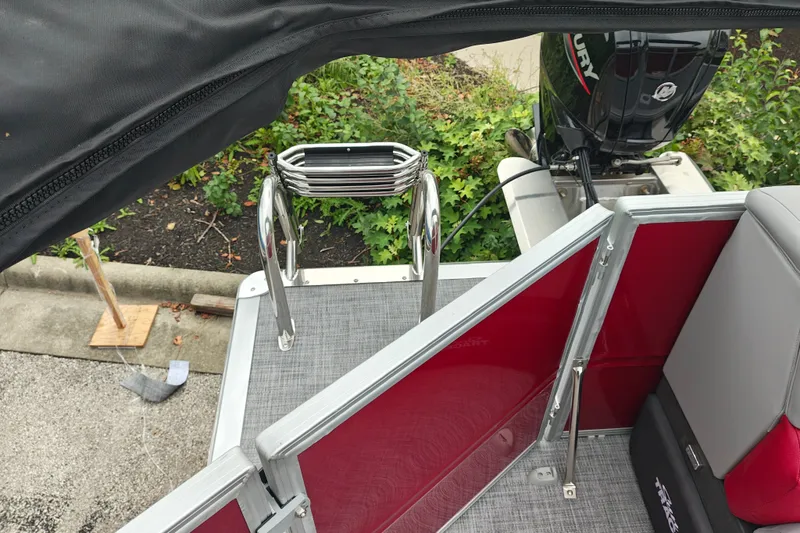 Slide: The Image of 2026 Sun Tracker Party Barge 20 DLX with Mercury outboard motor and boarding ladder. - 16