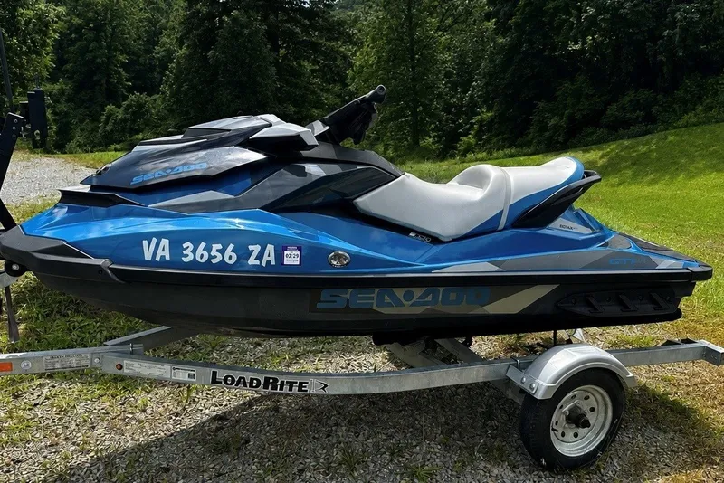 The Image of 2018 Sea-Doo GTI SE jet ski on trailer, parked outdoors. - 1