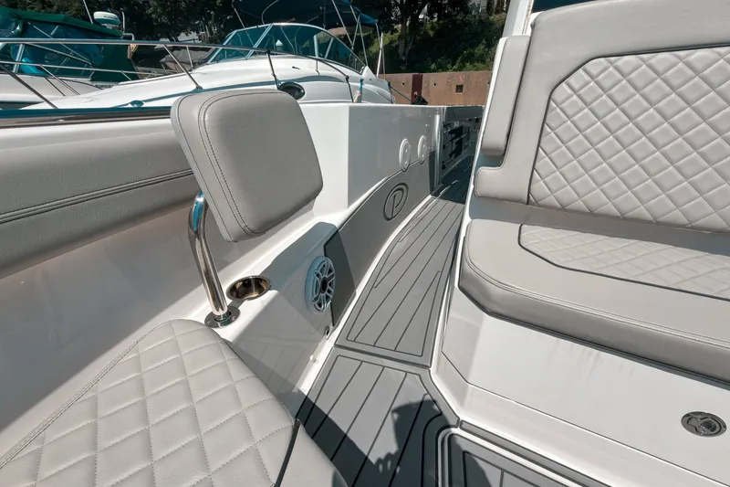 Slide: The Image of 2022 Pursuit S 288 Sport boat interior with quilted seating and sleek design. - 18