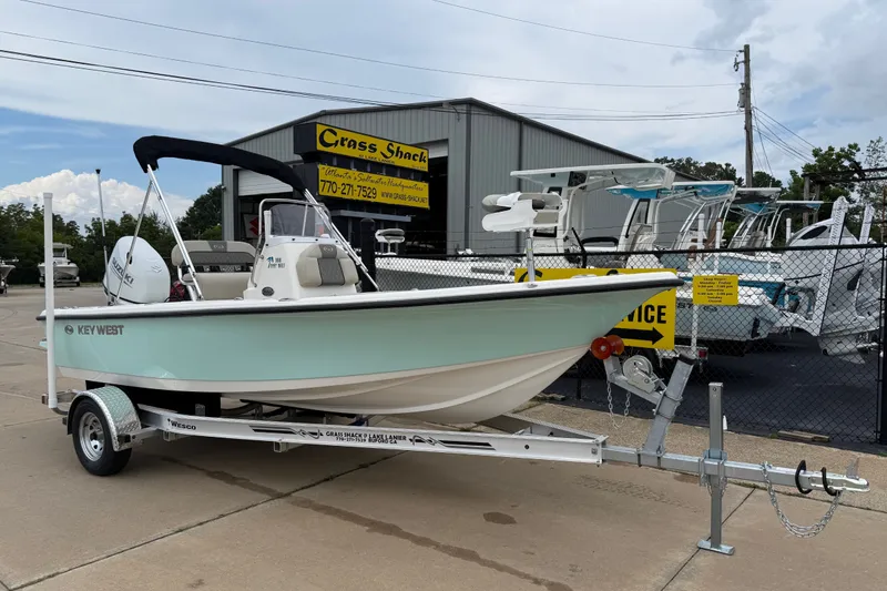 The Image of 2027 Key West 188 Bay Reef boat on trailer outside dealership. - 0