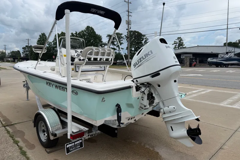 Slide: The Image of 2027 Key West 188 Bay Reef boat with Suzuki outboard motor on a trailer. - 8