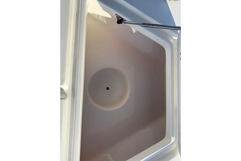 Slide: The Image of Storage compartment of 2026 Key West 188 Bay Reef boat, featuring a hydraulic lift. - 10