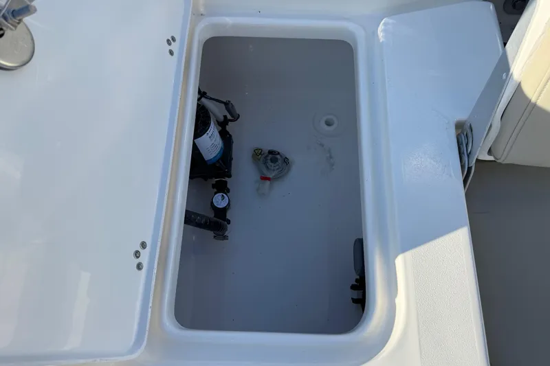 Slide: The Image of Open storage compartment on 2026 Key West 188 Bay Reef boat. - 14