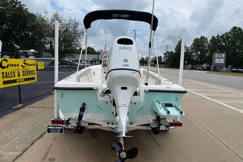 Slide: The Image of 2027 Key West 188 Bay Reef boat with outboard motor at sales service location. - 3