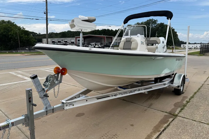 Slide: The Image of 2027 Key West 188 Bay Reef boat on trailer, parked outdoors. - 4