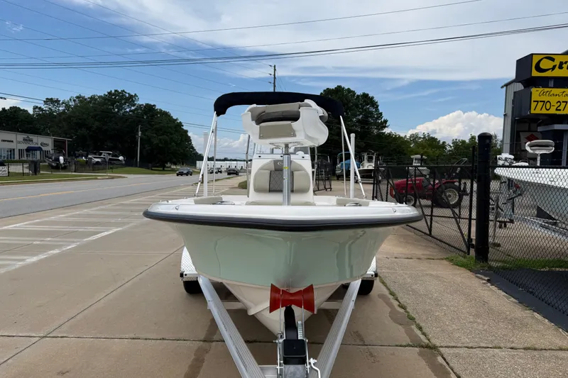 Slide: The Image of 2027 Key West 188 Bay Reef boat on trailer, parked outdoors. - 5