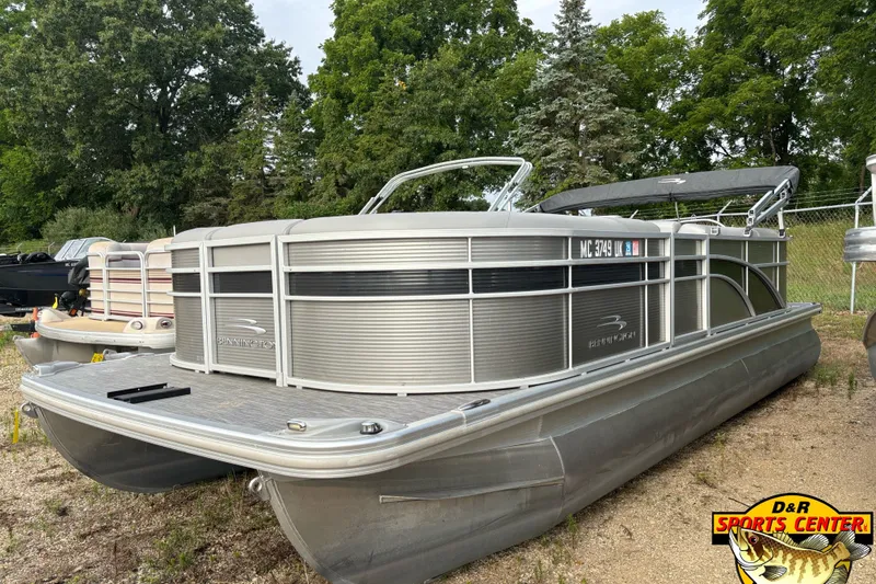 Slide: The Image of 2020 Bennington SX 22 SLX pontoon boat with canopy, parked outdoors at D&R Sports Center. - 3